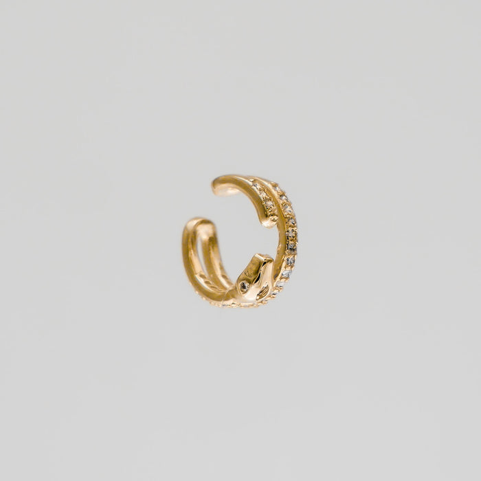 Gold snake-shaped earring with small diamonds.