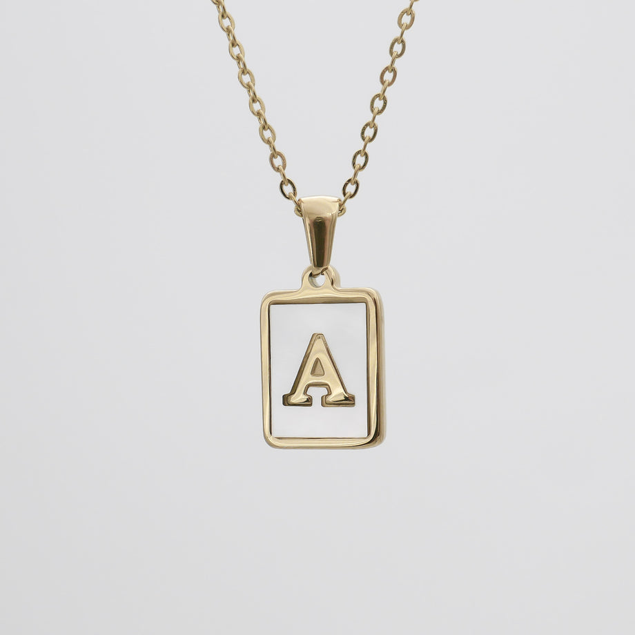 Gold necklace with a letter "A" pendant.