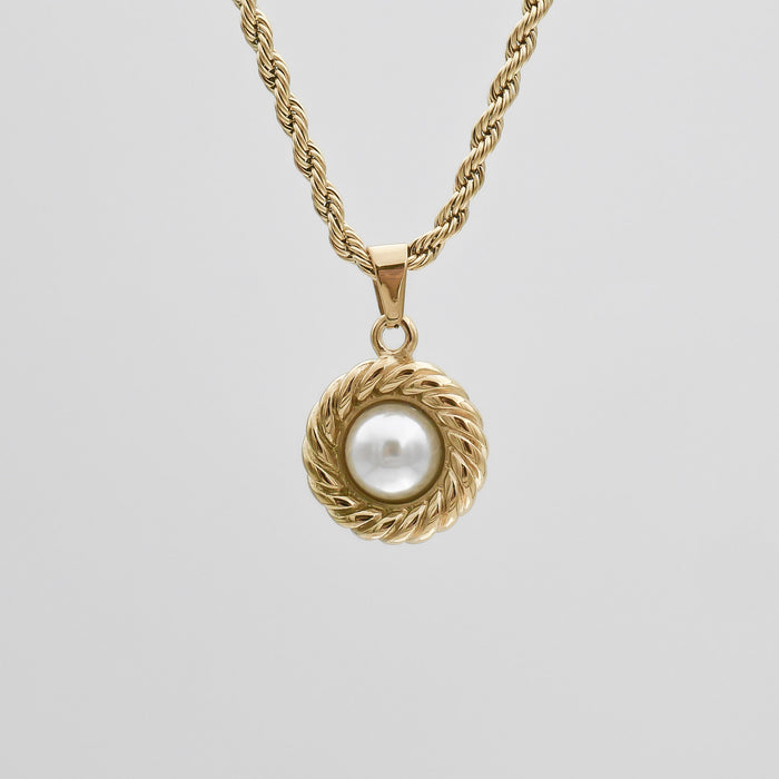 Gold necklace with pearl pendant.