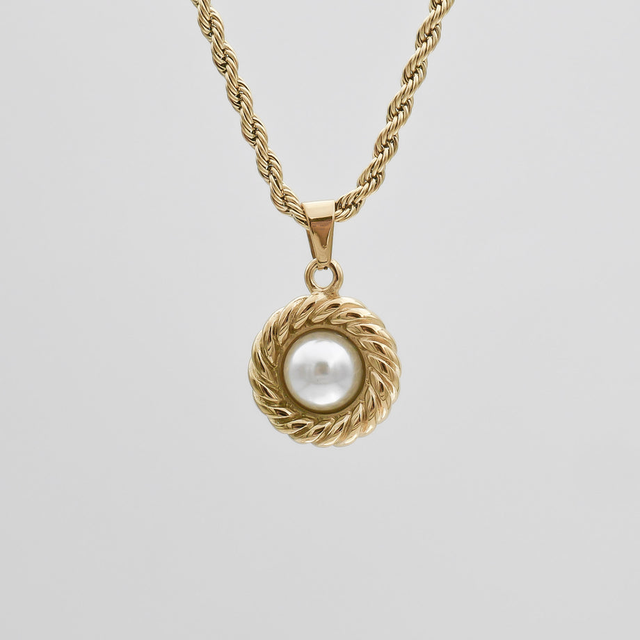 Gold necklace with pearl pendant.