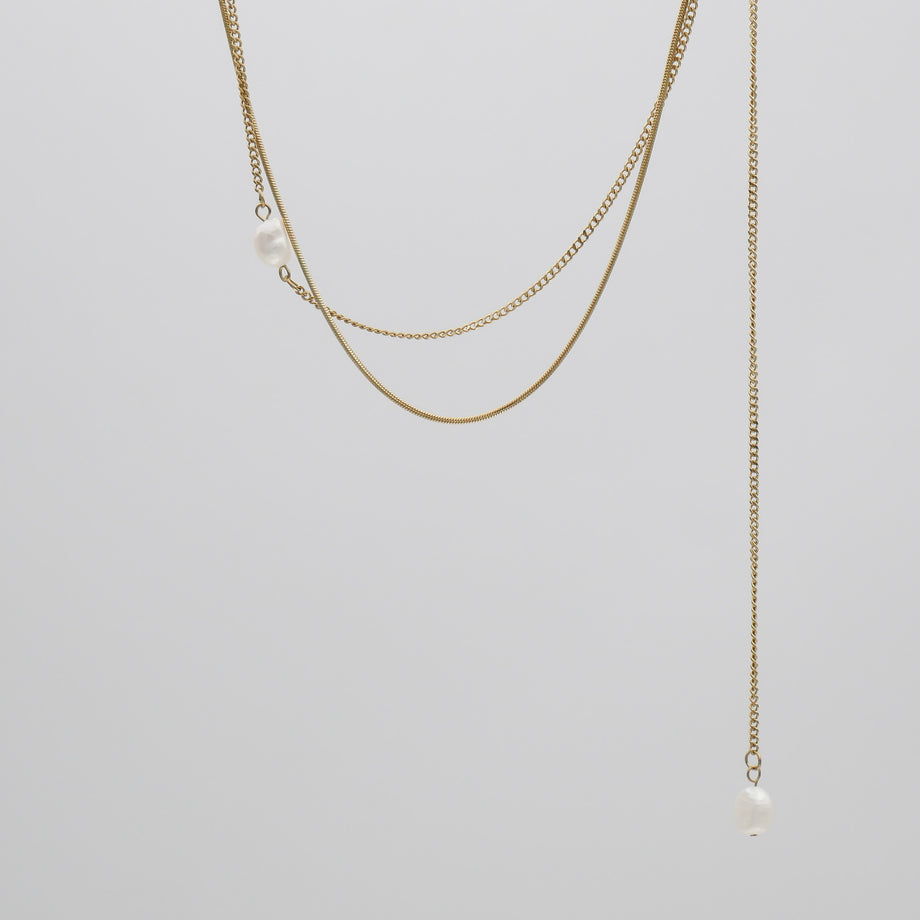 Gold layered necklace with pearls.