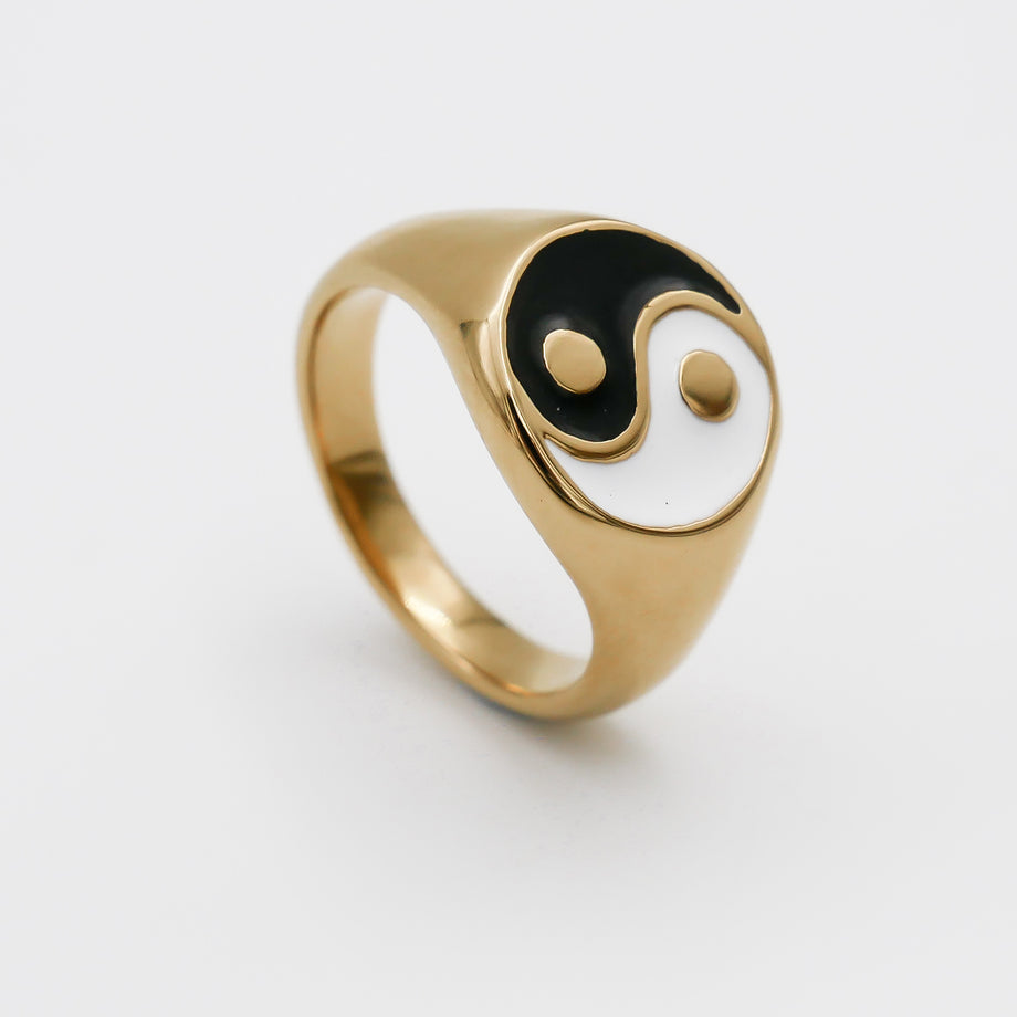 Gold ring with yin-yang symbol.