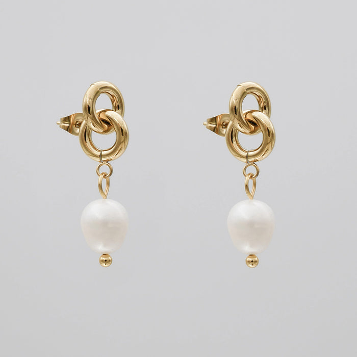 Gold chain earrings with dangling white pearls.