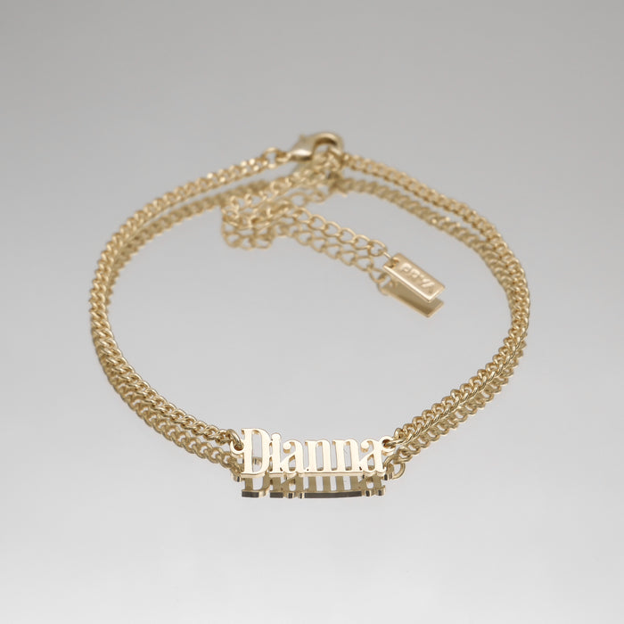 Gold anklet with "Dianna" nameplate.