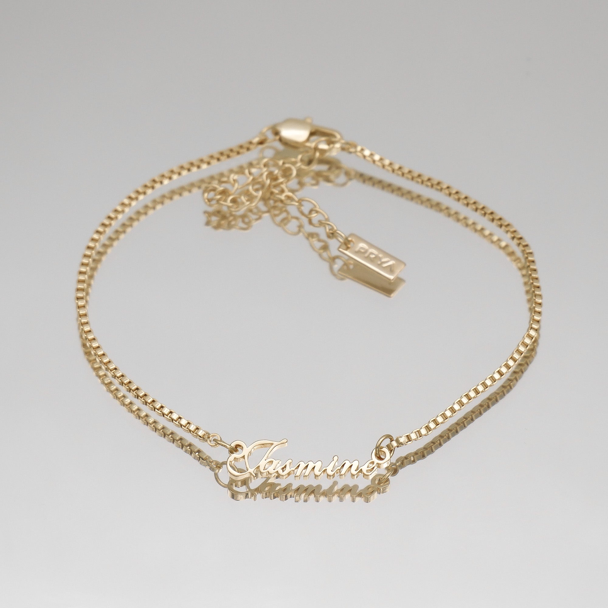 Gold name anklet on a box chain