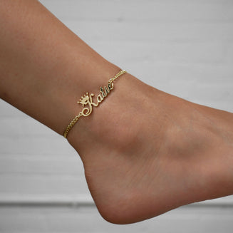 Gold personalised name anklet modelled on the ankle