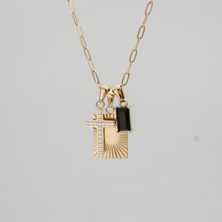 Gold necklace with cross and rectangular pendants.