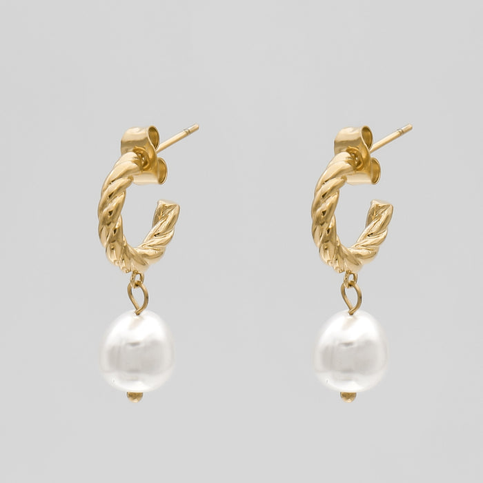 Gold twisted earrings with pearl drops.