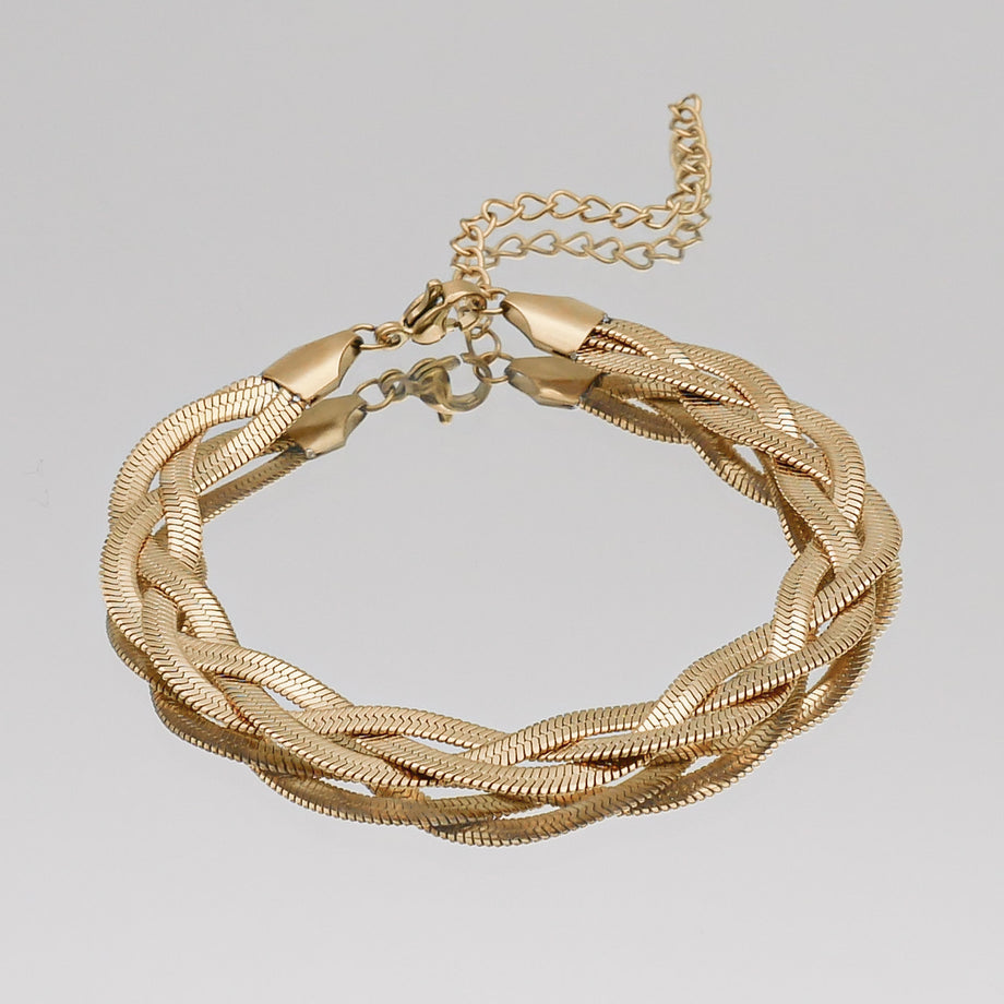 Gold braided bracelet with adjustable chain clasp.