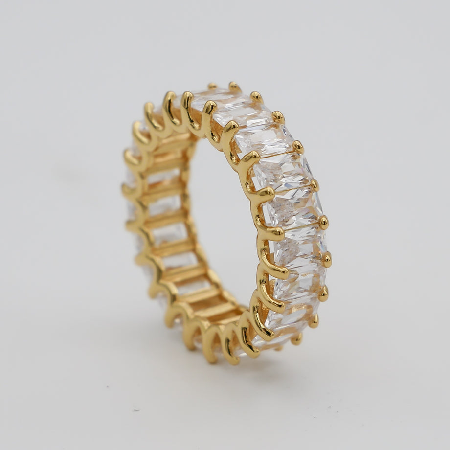 Gold ring with square-cut clear stones.