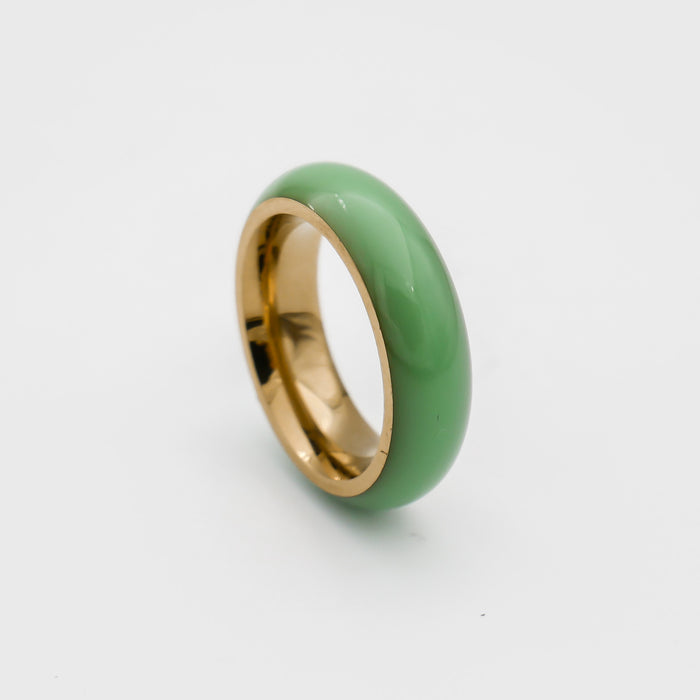 Gold ring with glossy green enamel finish.