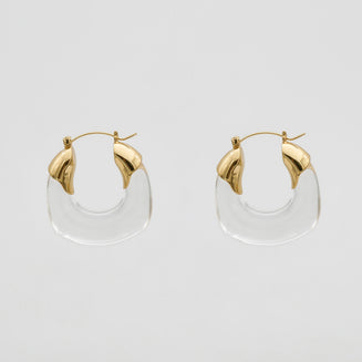 Clear Celine lucite hoop with an oval shape