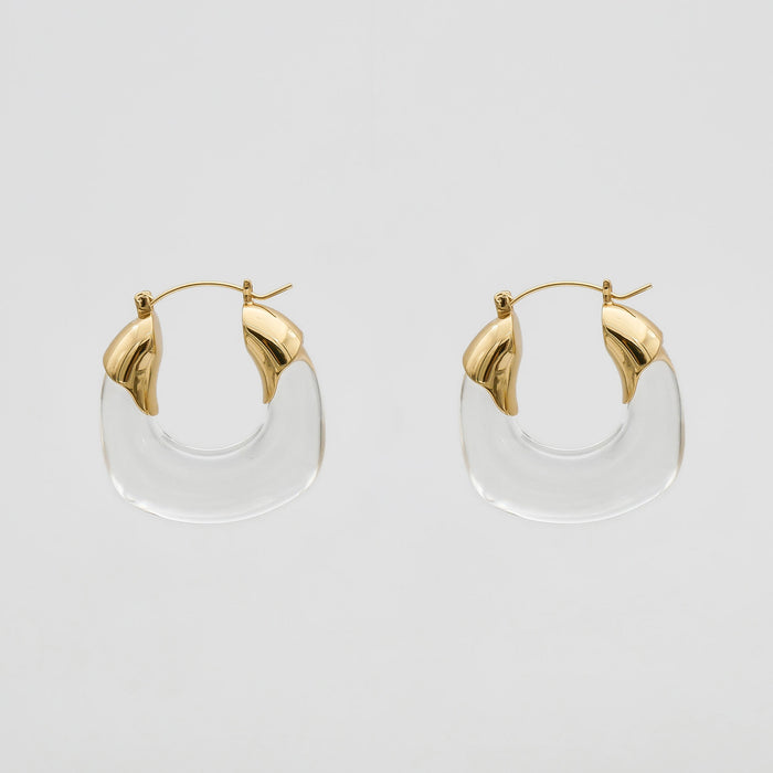 Clear Celine lucite hoop with an oval shape