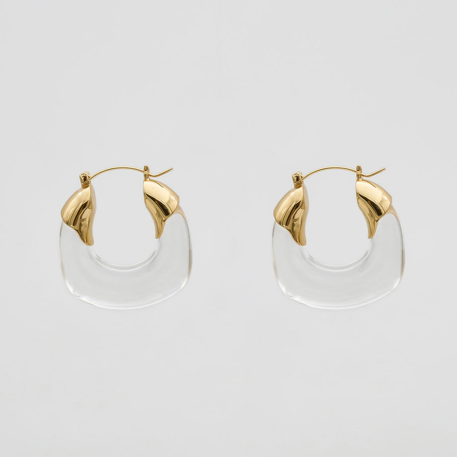 Clear Celine lucite hoop with an oval shape