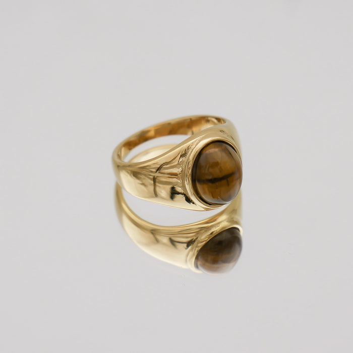 Gold ring with a tiger's eye stone.