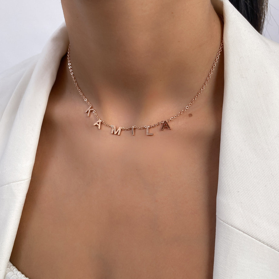 model wearing Classic suspended custom name necklace in rose gold plated from prya