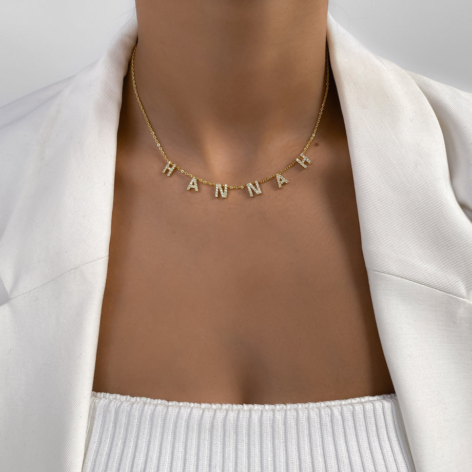 model wearing icy suspended custom name necklace in silver from prya