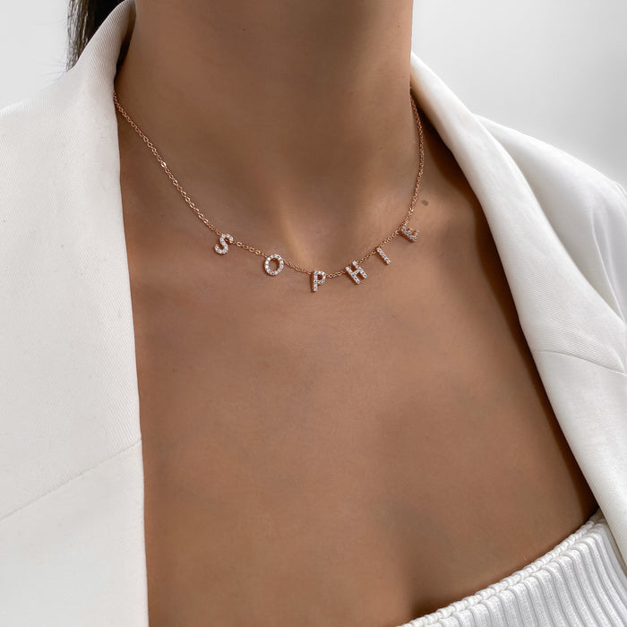 model wearing icy suspended custom name necklace in rose gold from prya