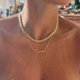 Model wearing waterproof Siena Personalised name necklace in gold by PRYA Jewellery UK