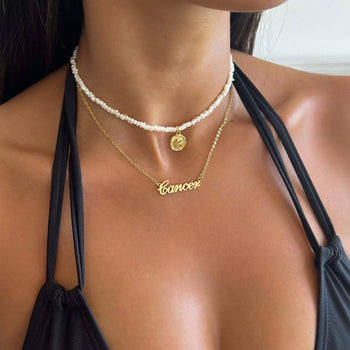 zodiac name necklace available in 18k gold plated or silver plated stainless steel from prya