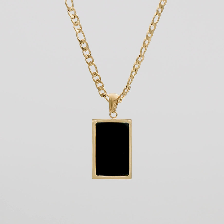 Gold chain with black rectangular pendant.