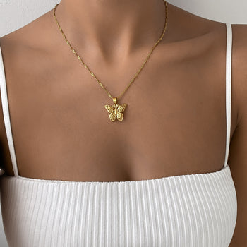 Front shot of model wearing the Gold butterfly necklace by PRYA