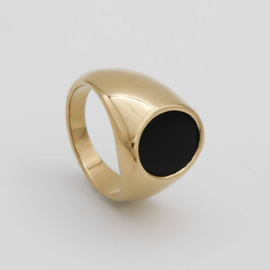 Gold ring with black onyx stone.