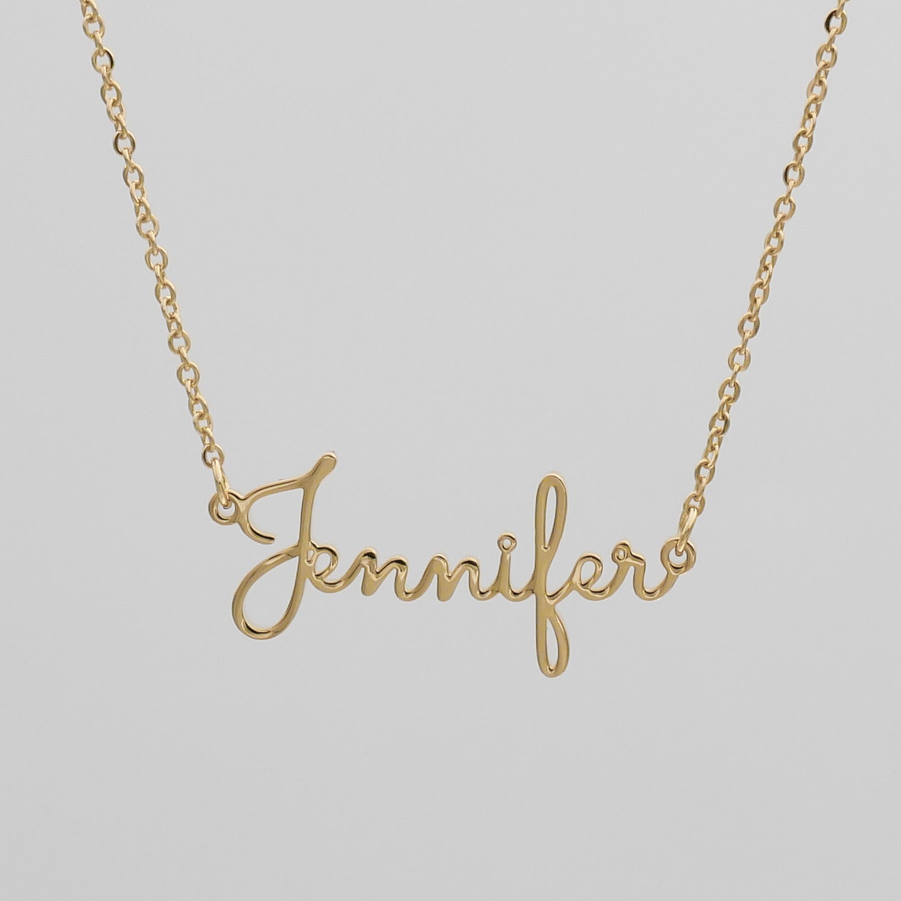 Gold London name necklace that says Jennifer 
