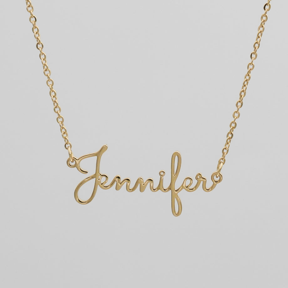 Gold London name necklace that says Jennifer 