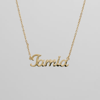 Gold Miami custom name necklace suspended in the air