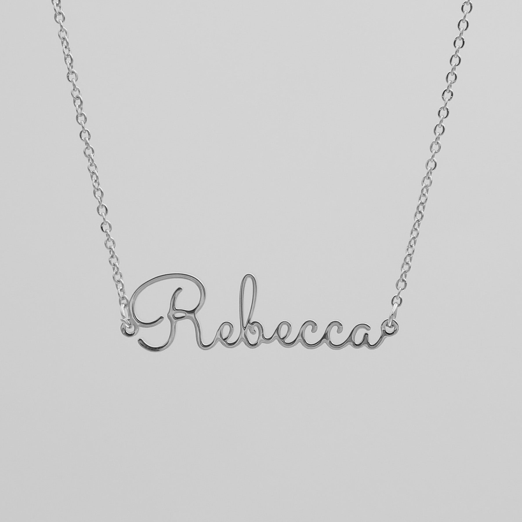 Silver name necklace that says Rebecca