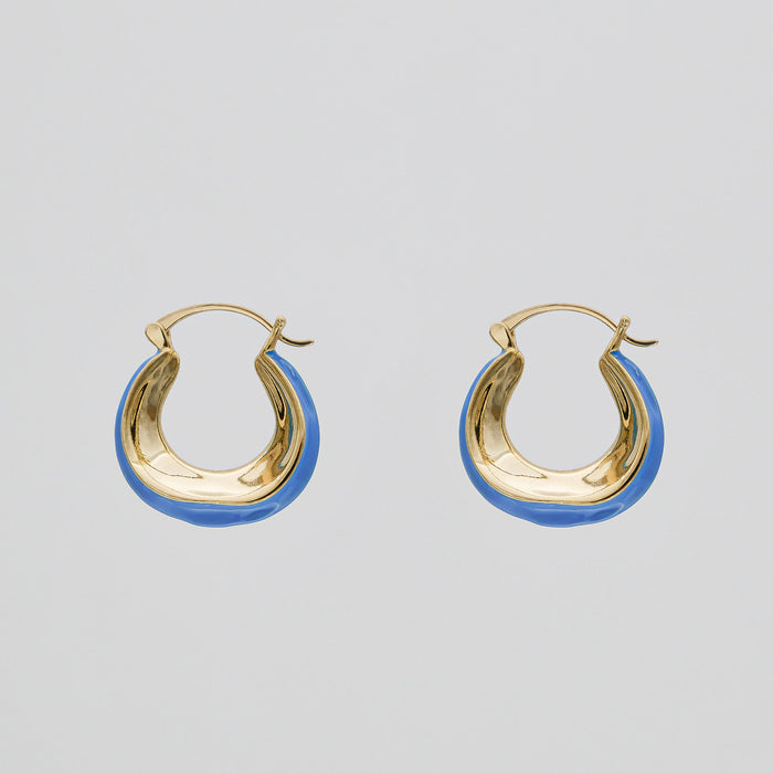 Gold and blue hoop earrings.