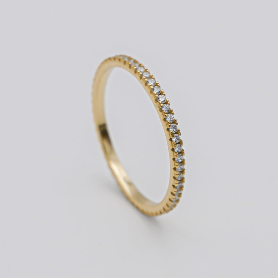 Gold ring with small diamonds in a circle.