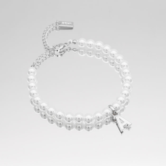 Pearl bracelet with silver letter "A" charm.