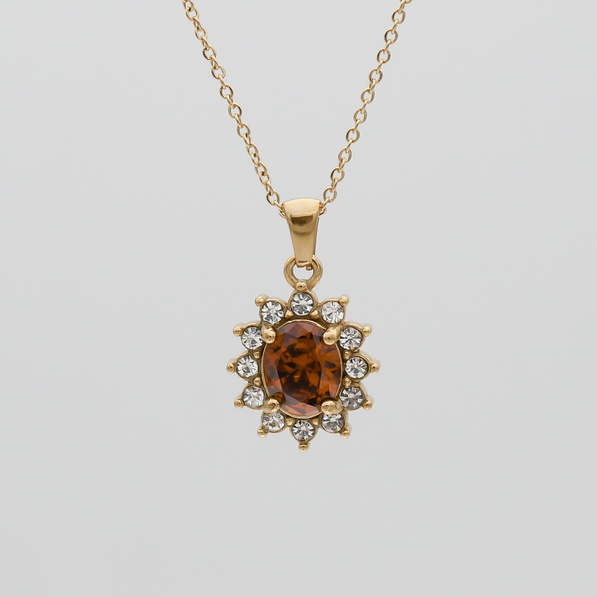 Gold Phoebe Ruby Gemstone Pendant Necklace with encrusted cubic Zirconia stones by PRYA