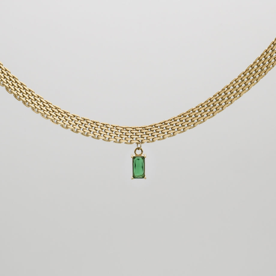 Gold necklace with emerald pendant.