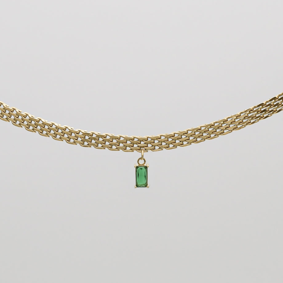 Gold necklace with emerald pendant.