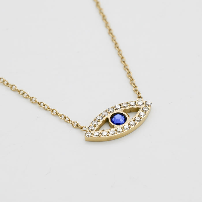 close up gold evil eye necklace with  paved cz stones and blue stone centre