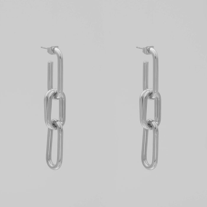 silver chain adjustable link earrings with three links on grey background.