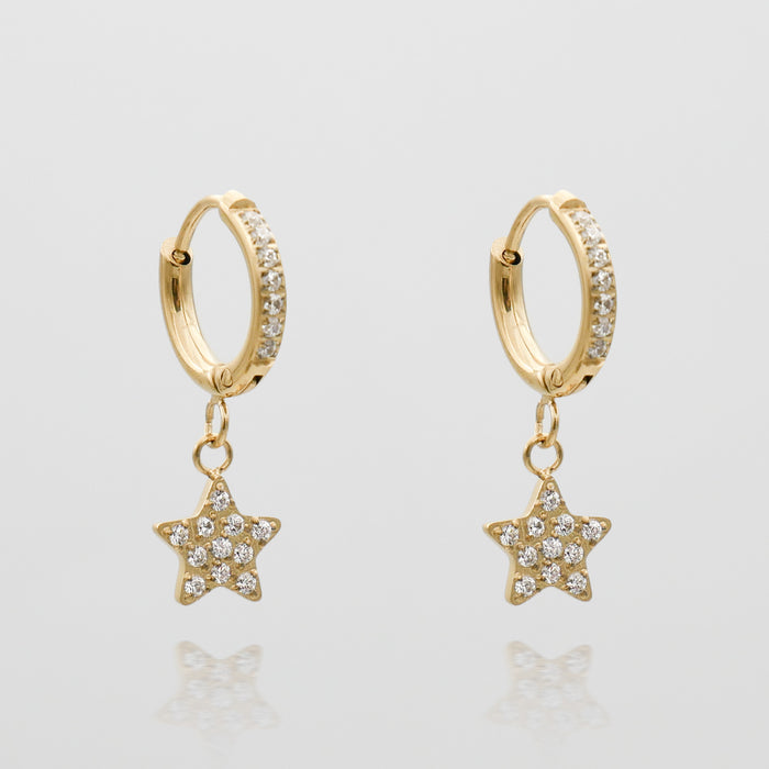 Gold hoop earrings with star-shaped pendants.