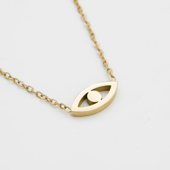 close up of Evil eye necklace in gold