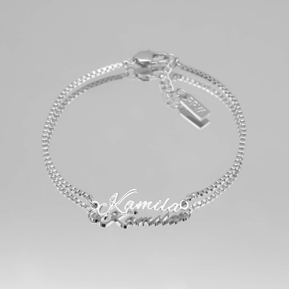 silver name bracelet with double chain.