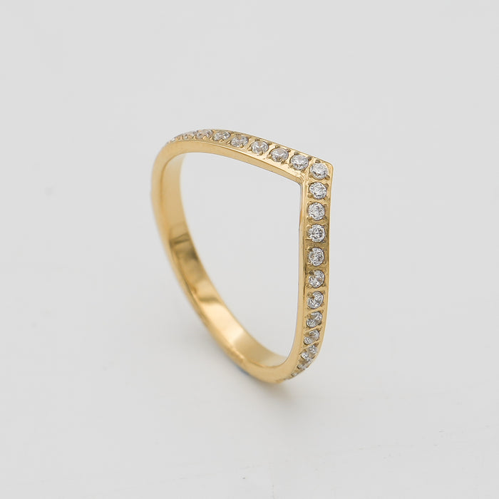 Gold chevron ring with small diamonds.