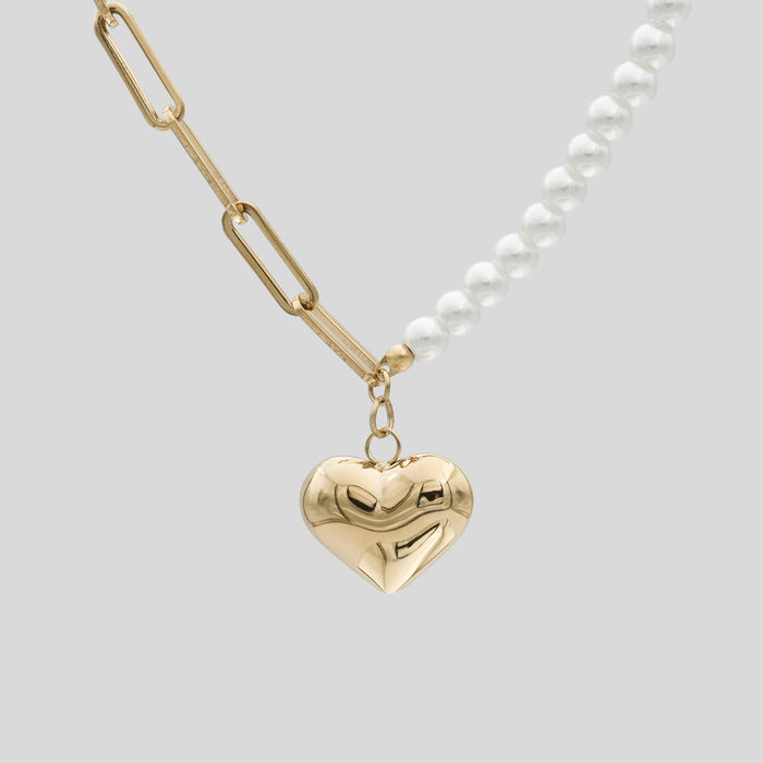 Gold heart pendant with pearls and chain necklace.