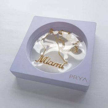 Gold Miami custom name necklace in display box