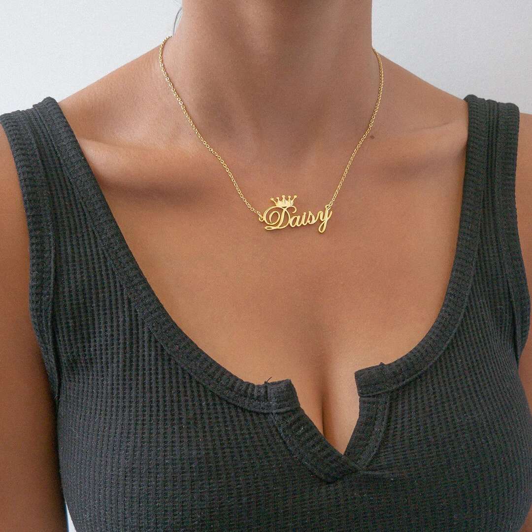 Woman wearing a grey top and sporting a Paris Customised Necklace