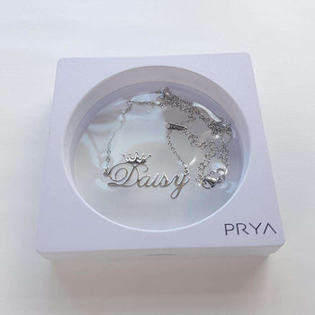 Silver customised necklace with Daisy's name.